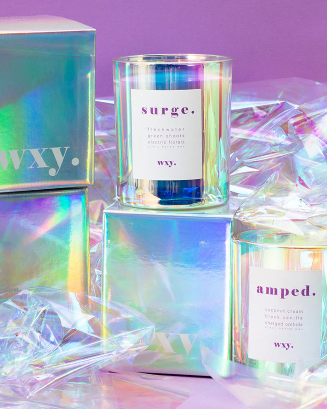 Holographic packaging for a Wxy. 8o Surge candle