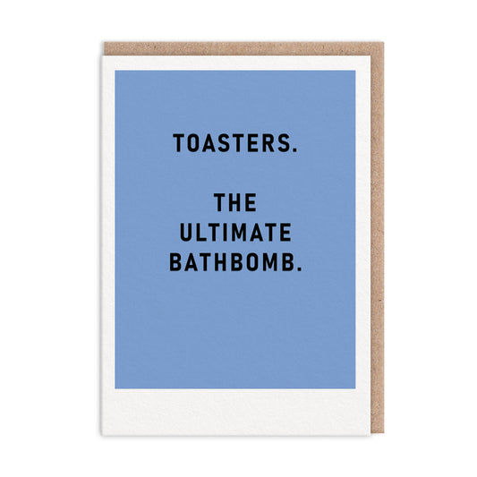 Blue greeting card with black foil text that reads "Toasters. The Ultimate Bathbomb"
