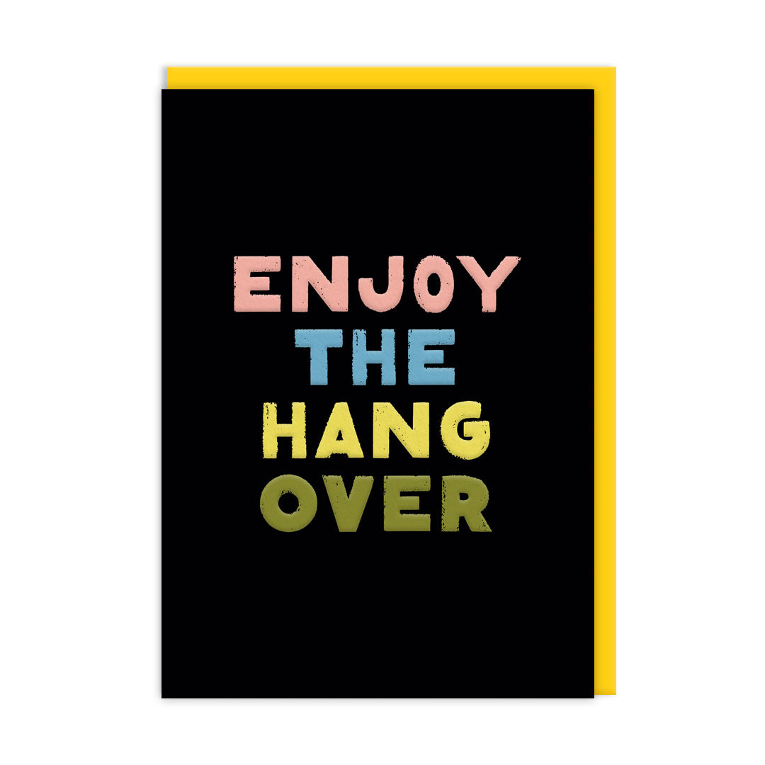 Black birthday card with multi coloured text that reads "Enjoy The Hangover" and accompanying Yellow envelope