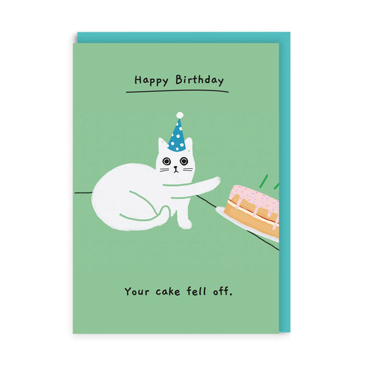 Green Birthday Card with an illustration of a cat intentionally pushing a cake off a table. Text reads Happy Birthday, Your cake fell off