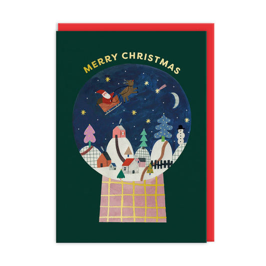 Christmas Card featuring a snow globe which has Santa flying over a village. Text reads Merry Christmas