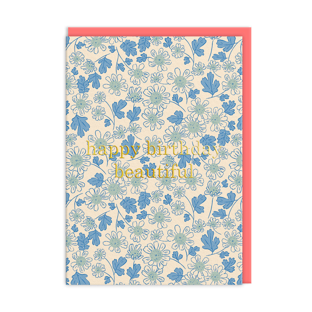 Birthday card with a blue daisies design and gold foil text reads Happy Birthday Beautiful