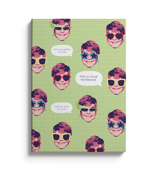 Green Notebook featuring Elton John Illustrations and the text This Is Your Notebook