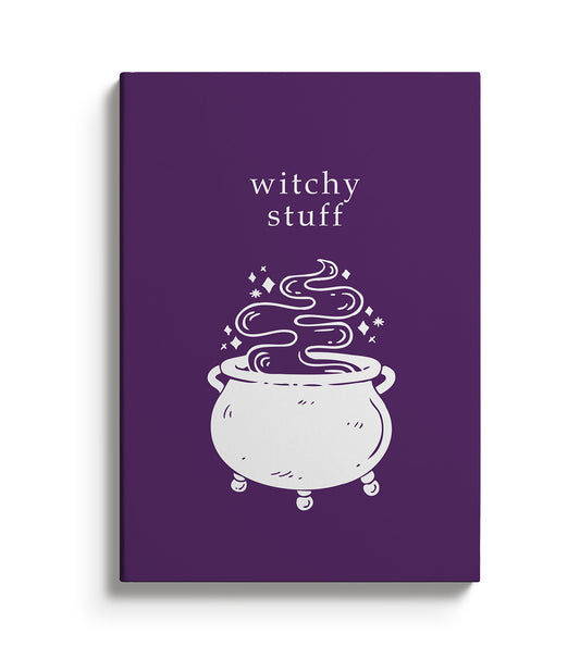 Purple Notebook with a cauldron illustration and  text that reads Witchy Stuff