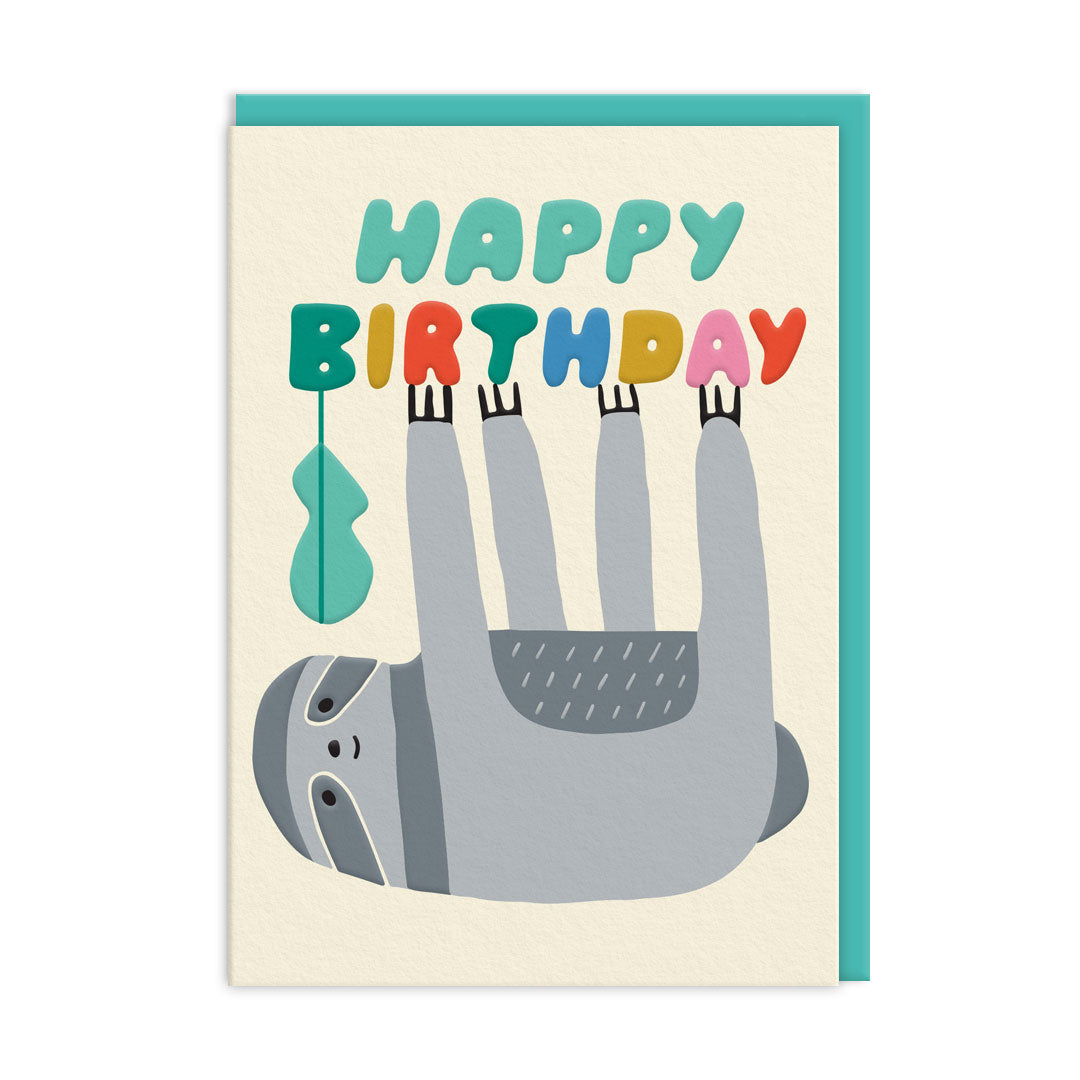 Sloth Happy Birthday Card, grey sloth hanging upside from the text which reads 'happy birthday'