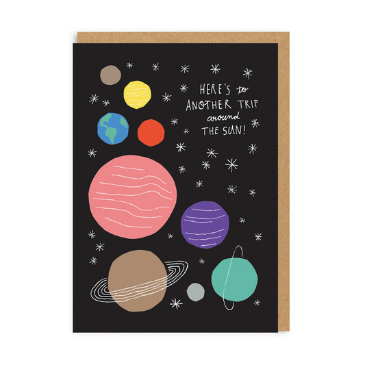 Birthday card with black background and illustrated planets, with white stars and white text quote