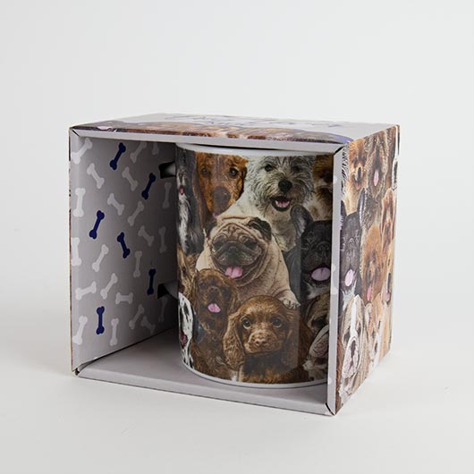 Coffee mug with images of various dog breeds in packaging box