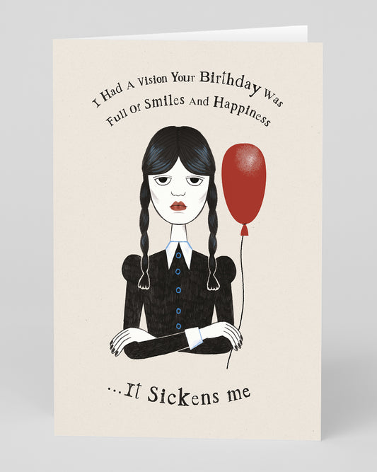 a birthday card with Wednesday Addams holding a balloon