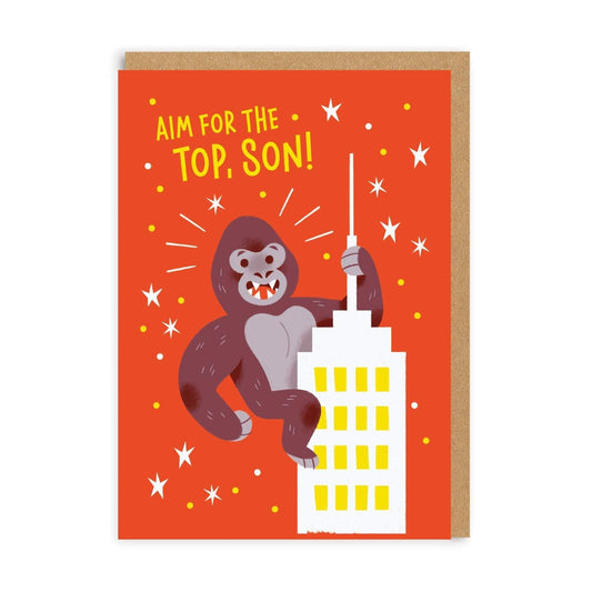 Orange greetings card with illustration of Gorilla on top of building, with wording 'Aim for the top, Son' 